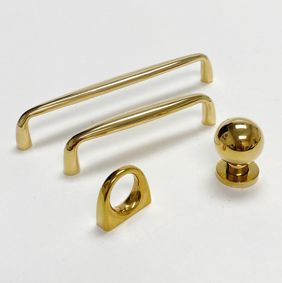 Omni Cabinet Knobs and Drawer Pulls in Polished Unlacquered Brass
